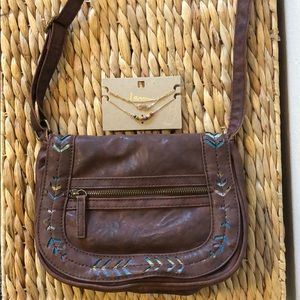 Brown crossbody bag with cute embroidered details.
